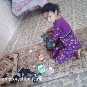 IDP child playing with very simple toys